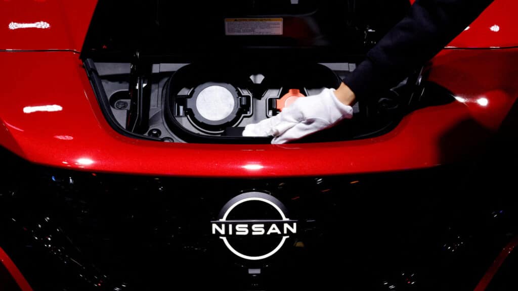 FILE PHOTO: A staff cleans charging ports of Nissan's Leaf battery electric vehicle during the Japan Mobility Show 2023 at Tokyo Big Sight in Tokyo, Japan, November 1, 2023. REUTERS/Kim Kyung-Hoon/File Photo