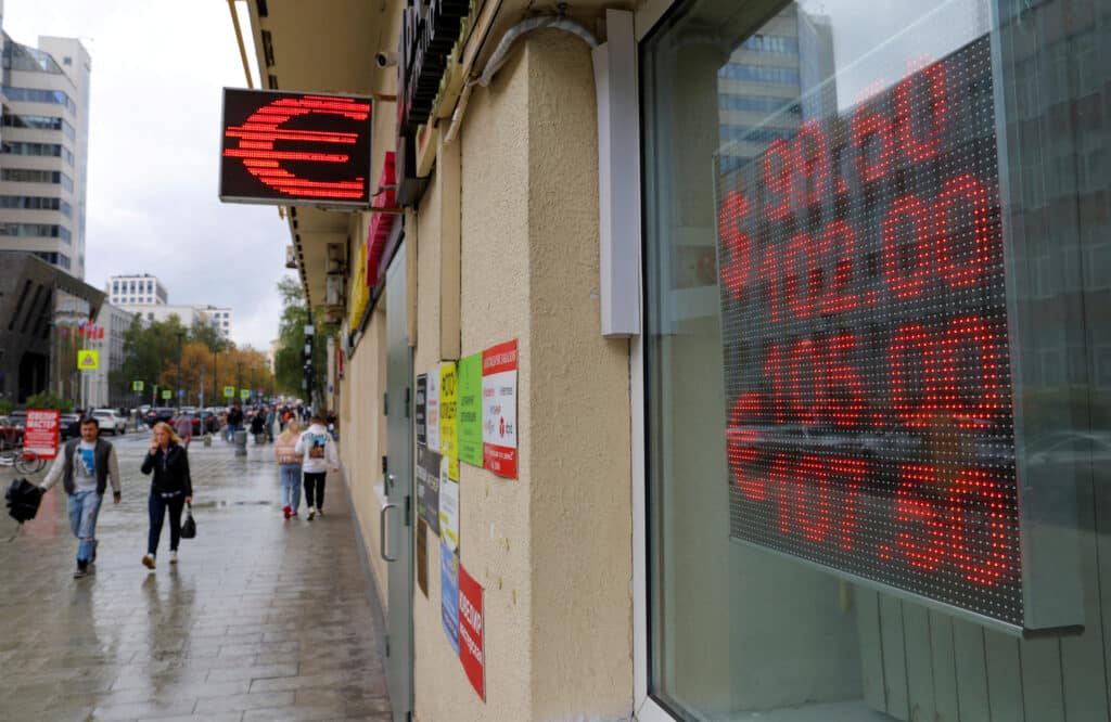 FILE PHOTO: A board showing currency exchange rates of the U.S. dollar and euro against Russian rouble is on display in a street in Moscow, Russia, October 6, 2023. REUTERS/Evgenia Novozhenina/File Photo