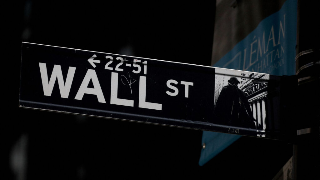 FILE PHOTO: A Wall St. street sign is seen near the New York Stock Exchange (NYSE) in New York City, U.S., September 17, 2019. REUTERS/Brendan McDermid/File Photo