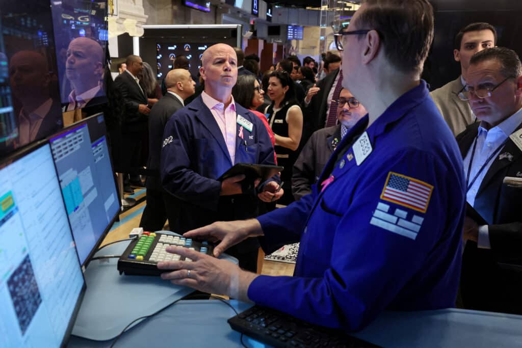 FILE PHOTO: Traders work on the floor at the New York Stock Exchange (NYSE) in New York City, U.S., June 14, 2024.  REUTERS/Brendan McDermid/File Photo