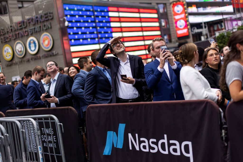 People watch the Nasdaq building with the logo of Blackrock after attending the closing bell to celebrate the launch of the first U.S. spot Ethereum ETF at the Nasdaq MarketSite, at Times Square in New York City, U.S., on July 25, 2024.  REUTERS/Eduardo Munoz