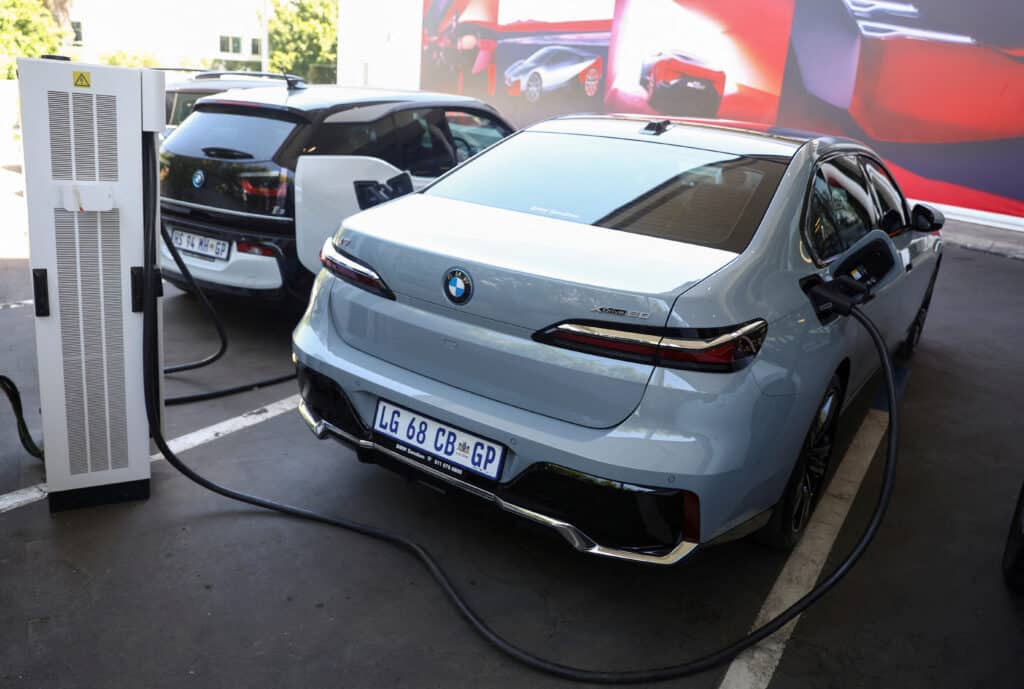 FILE PHOTO: A BMW i7 xDrive60 elecric car is connected to a charging point at a BMW dealership in Sandton, South Africa, October 27, 2023. REUTERS/Siphiwe Sibeko/File Photo