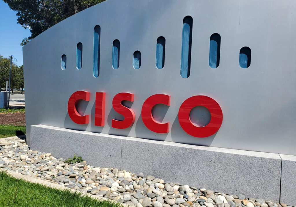 FILE PHOTO: A sign bearing the logo for communications and security tech giant Cisco Systems Inc is seen outside one of its offices in San Jose, California, U.S. August 11, 2022. REUTERS/Paresh Dave/File Photo
