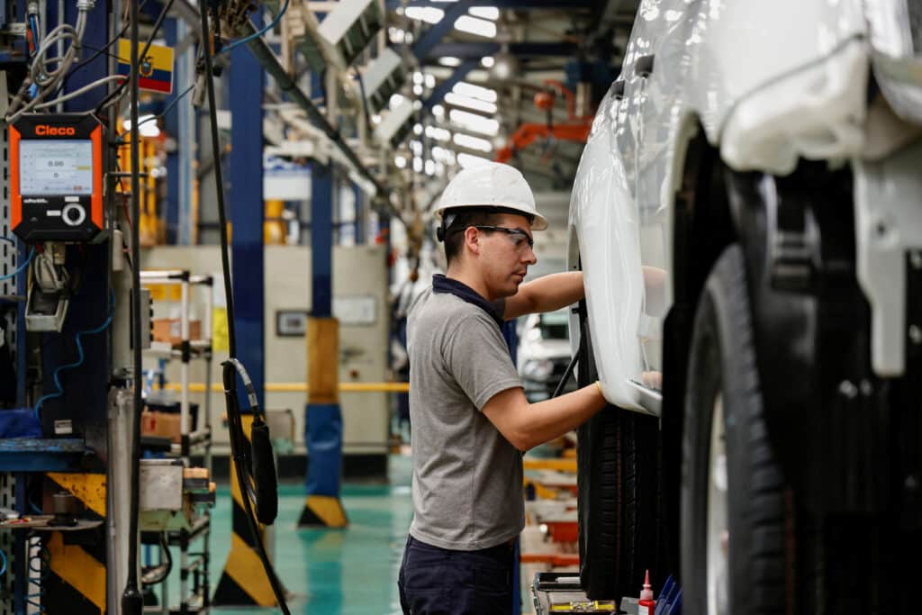 A person works on one of the production lines at the General Motors' GM.N factory in Ecuador, which will stop production amid pressure from competitors but still sell vehicles in the country, in Quito, Ecuador September 2, 2024. REUTERS/Karen Toro