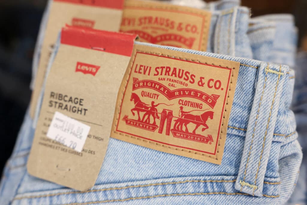 FILE PHOTO: A logo is displayed on a pair of jeans at the Levi’s outlet retail store at Bicester Village in Oxfordshire, Britain, August 21, 2024. REUTERS/Hollie Adams/File Photo