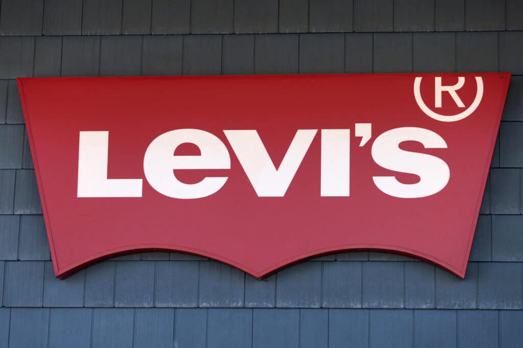 FILE PHOTO: The signage of Levi Strauss &amp; Co. store is seen at the Woodbury Common Premium Outlets in Central Valley, New York, U.S., February 15, 2022. REUTERS/Andrew Kelly/File Photo