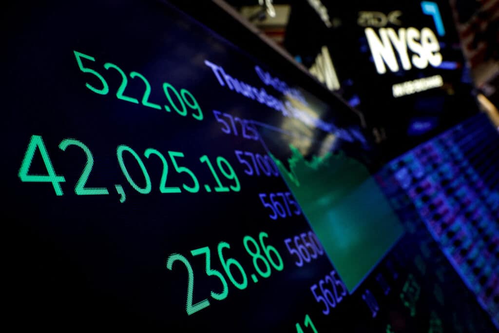 FILE PHOTO: A screen displays the Dow Jones Industrial Average after the closing bell on the floor at the New York Stock Exchange (NYSE) in New York City, U.S., September 19, 2024.  REUTERS/Brendan McDermid/File Photo