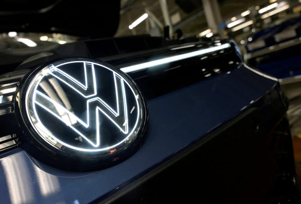 FILE PHOTO: Volkswagen logo is illuminated on a production line for the Golf VIII and Tiguan cars at the VW headquarters in Wolfsburg, Germany May 23, 2024. REUTERS/Fabian Bimmer/File Photo