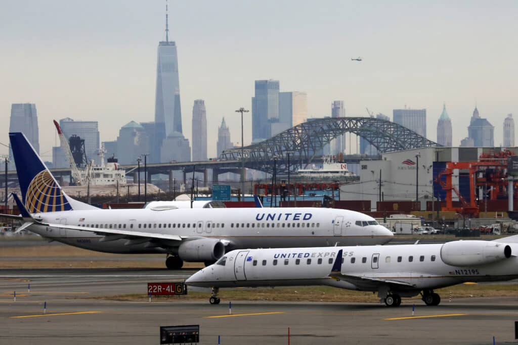 FILE PHOTO: United Airlines passenger jets taxi with New York City as a backdrop, at Newark Liberty International Airport, New Jersey, U.S. December 6, 2019. REUTERS/Chris Helgren/File Photo