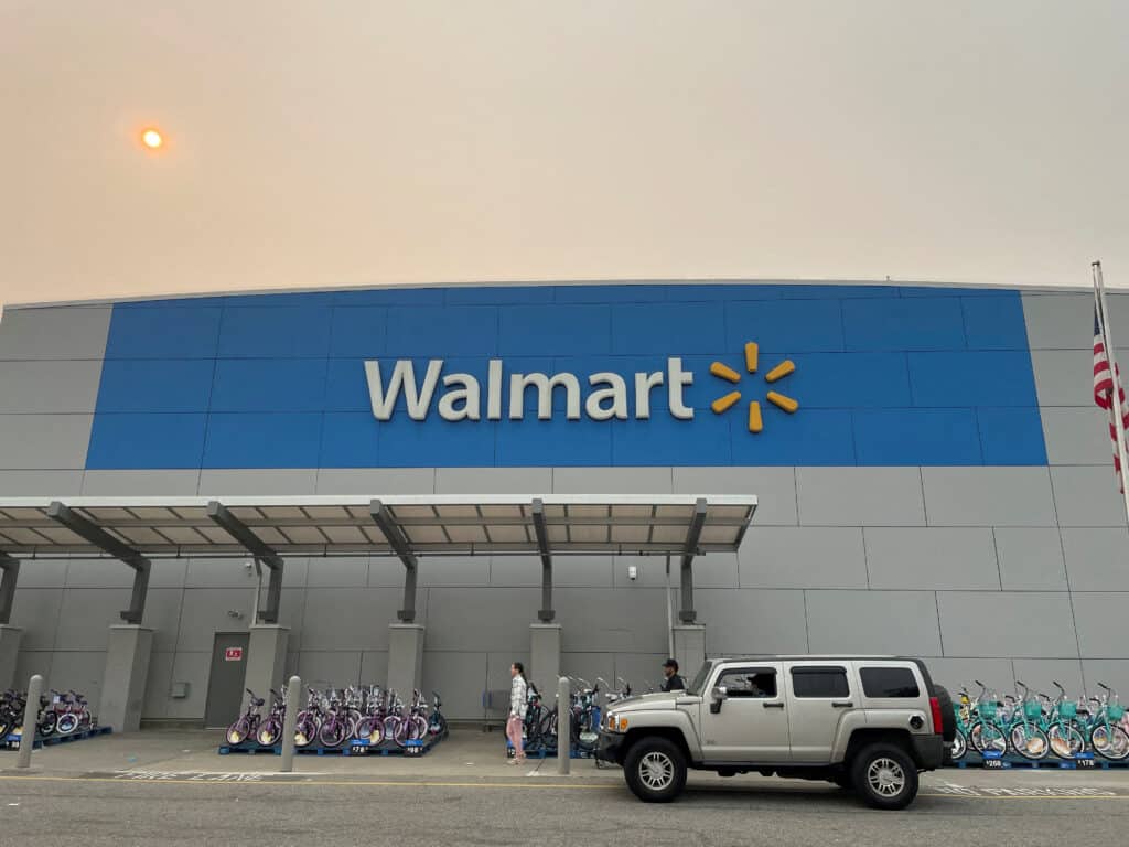 FILE PHOTO: A shopper leaves a Walmart Supercenter in Secaucus, New Jersey, U.S., June 7, 2023. The store is one of its newly remodeled locations. REUTERS/Siddharth Cavale/File Photo