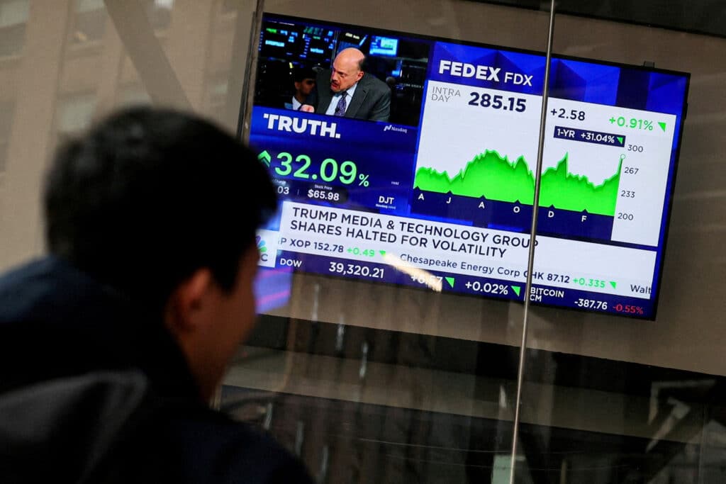 FILE PHOTO: A screen displays trading information about shares of Truth Social and Trump Media &amp; Technology Group, outside the Nasdaq Market site in New York City, U.S., March 26, 2024.  REUTERS/Brendan McDermid/File Photo