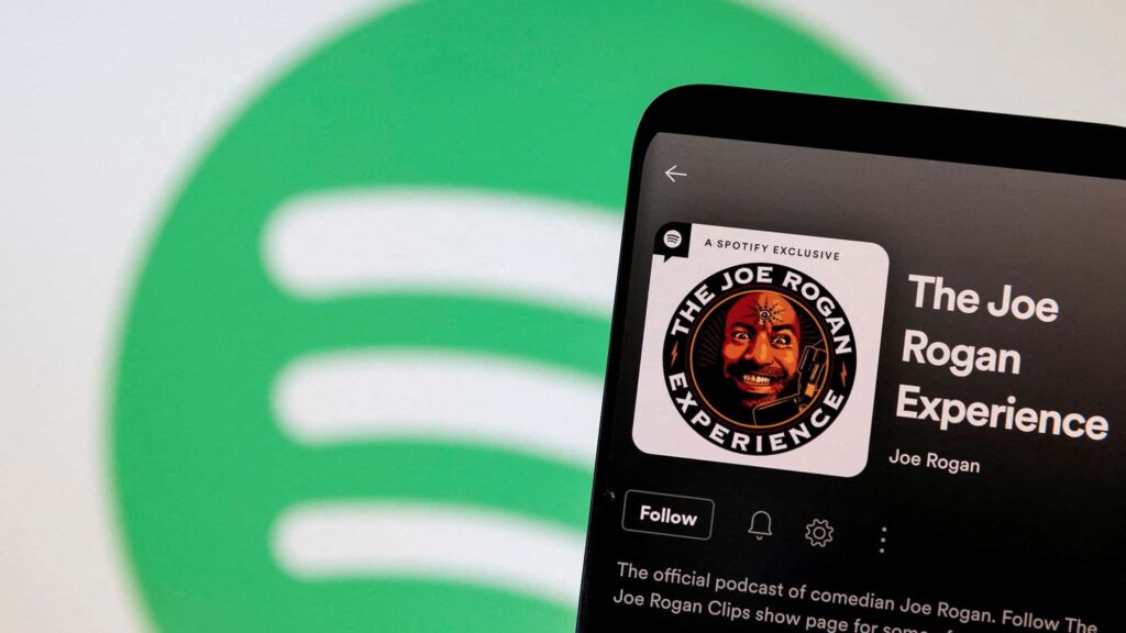 FILE PHOTO: Joe Rogan's Spotify profile is seen in front of displayed Spotify logo in this photo illustration taken, February 7, 2022. REUTERS/Dado Ruvic/Illustration/File Photo