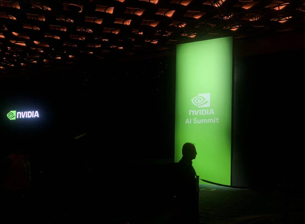 A man walks past the Nvidia logo at the company's AI Summit in Mumbai, India, October 24, 2024. REUTERS/Arsheeya Bajwa