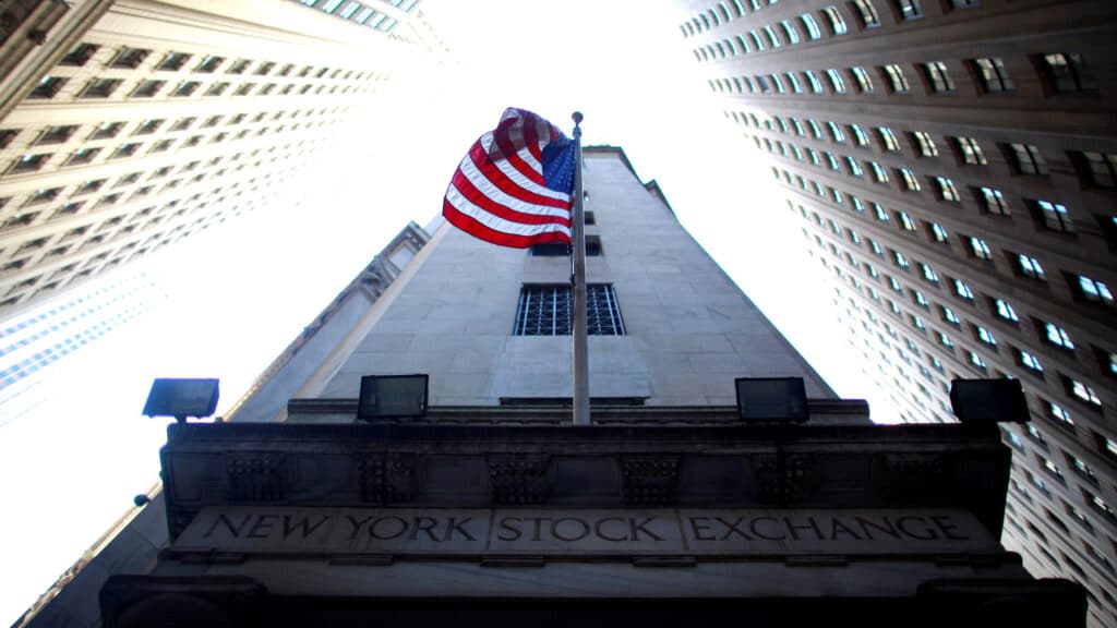 FILE PHOTO: A flag flies at the exterior of New York Stock Exchange June 15, 2012. REUTERS/Eric Thayer/File Photo