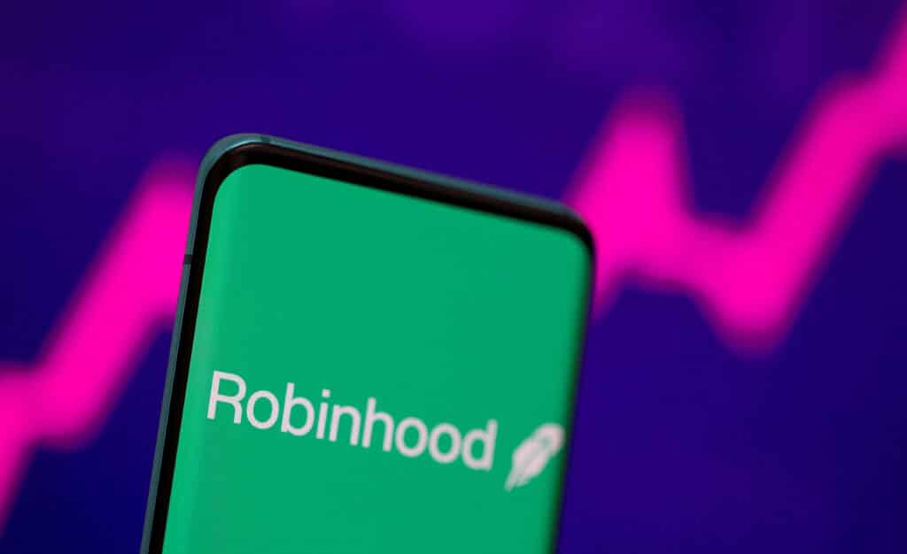 FILE PHOTO: Robinhood logo is seen on a smartphone in front of a displayed stock graph in this illustration taken, July 2, 2021. REUTERS/Dado Ruvic/Illustration/File Photo