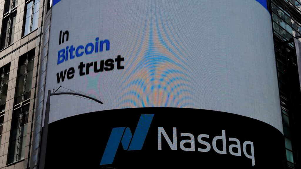 FILE PHOTO: The logo for Coinbase Global Inc, the biggest U.S. cryptocurrency exchange, is displayed on the Nasdaq MarketSite jumbotron at Times Square in New York, U.S., April 14, 2021. REUTERS/Shannon Stapleton/File Photo