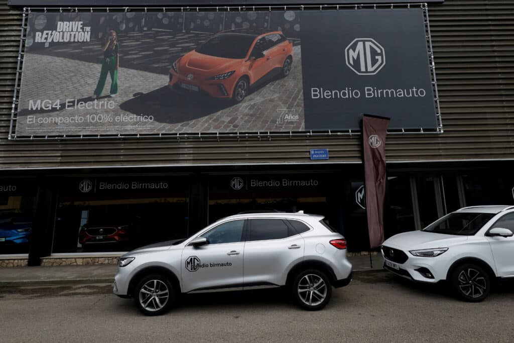 FILE PHOTO: A poster for an MG-4 EV, a brand of Chinese state-owned carmaker SAIC, is displayed at a car showroom in Santander, Spain, June 13, 2024. REUTERS/Vincent West/File Photo