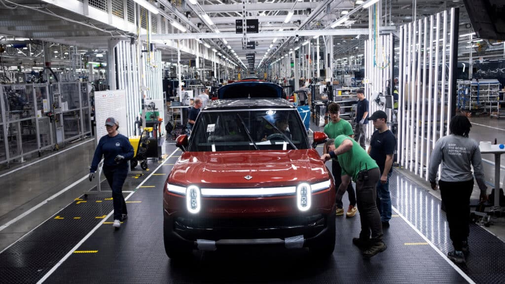 FILE PHOTO: Workers assemble second-generation R1 vehicles at electric auto maker Rivian's manufacturing facility in Normal, Illinois, U.S. June 21, 2024.  REUTERS/Joel Angel Juarez/File Photo