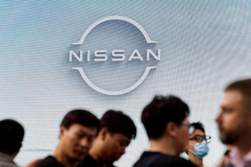 FILE PHOTO: Visitors walk past a Nissan logo at the Beijing International Automotive Exhibition, or Auto China 2024, in Beijing, China, April 25, 2024. REUTERS/Tingshu Wang/File Photo