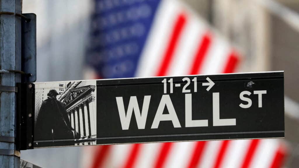 FILE PHOTO: FILE PHOTO: A street sign for Wall Street is seen outside the New York Stock Exchange (NYSE) in New York City, New York, U.S., July 19, 2021. REUTERS/Andrew Kelly/File Photo/File Photo