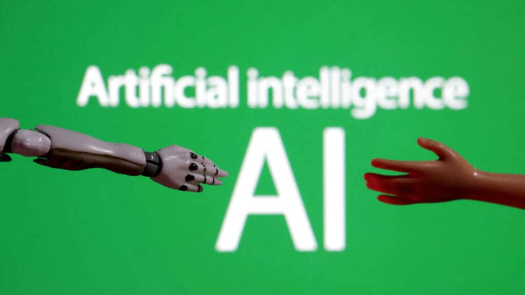 FILE PHOTO: Words reading "Artificial intelligence AI", miniature of robot and toy hand are pictured in this illustration taken December 14, 2023. REUTERS/Dado Ruvic/Illustration/File Photo