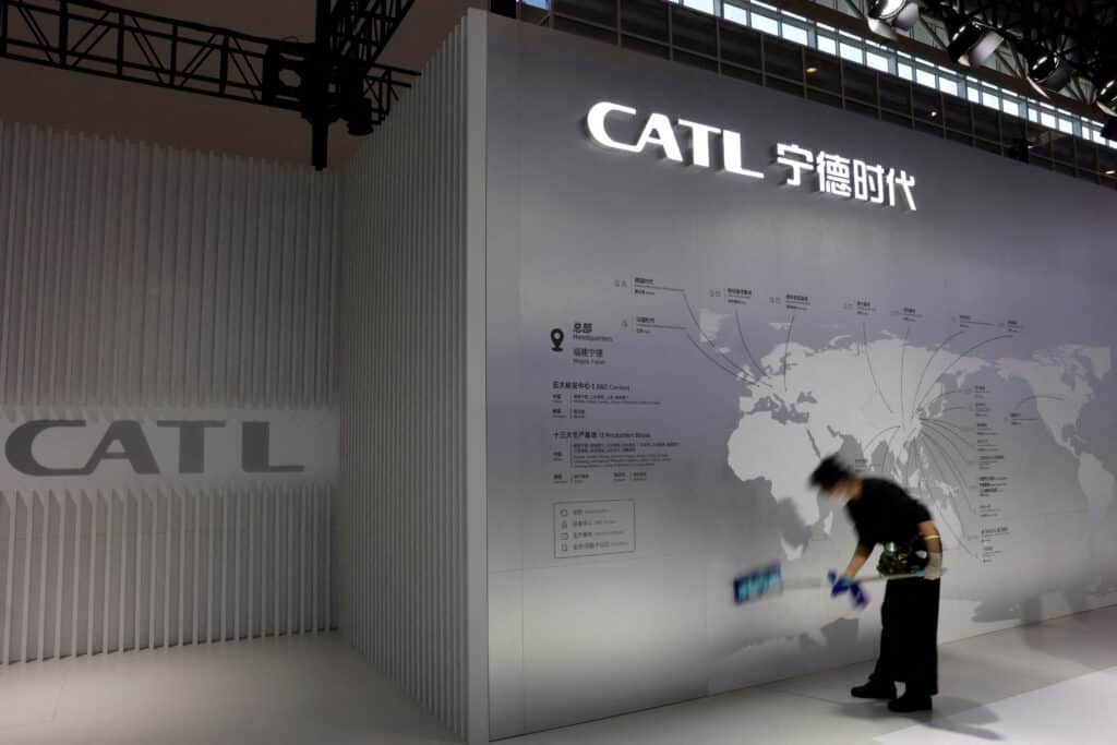 FILE PHOTO: A staff member cleans a display showing the locations of battery maker CATL's production bases, at the CATL booth during the first China International Supply Chain Expo (CISCE) in Beijing, China November 28, 2023. REUTERS/Florence Lo/File Photo