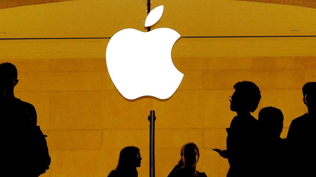 FILE PHOTO: Customers walk past an Apple logo inside of an Apple store at Grand Central Station in New York, U.S., August 1, 2018.  REUTERS/Lucas Jackson/File Photo