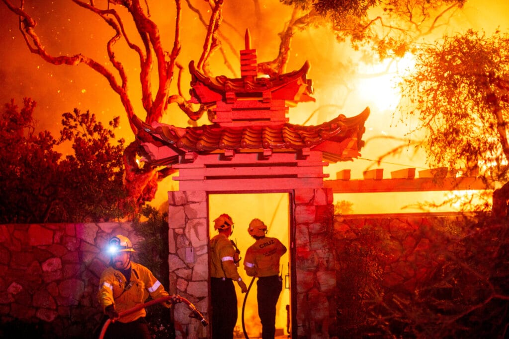 Firefighters battle the Palisades Fire as it burns during a windstorm on the west side of Los Angeles, California, U.S. January 8, 2025. REUTERS/Ringo Chiu           SEARCH "CALIFORNIA WILDFIRES" FOR THIS STORY. SEARCH "WIDER IMAGE" FOR ALL STORIES.           TPX IMAGES OF THE DAY