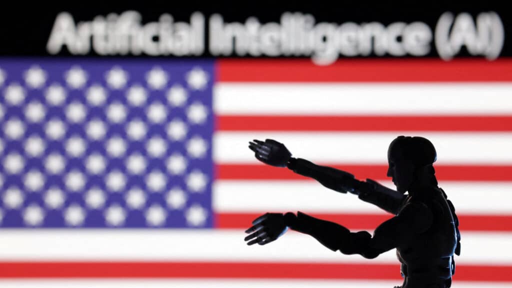 FILE PHOTO: AI Artificial intelligence words, miniature of robot and U.S. flag are seen in this illustration taken December 21, 2023. REUTERS/Dado Ruvic/Illustration/File Photo