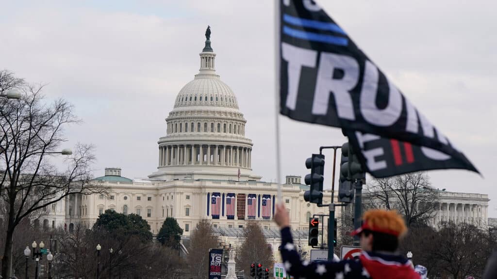 An anti-abortion demonstrator holds up a flag in support of U.S. President Donald Trump, as anti-abortion demonstrators attend the annual "March for Life", near the U.S. Capitol building in Washington, U.S., January 24, 2025. REUTERS/Elizabeth Frantz