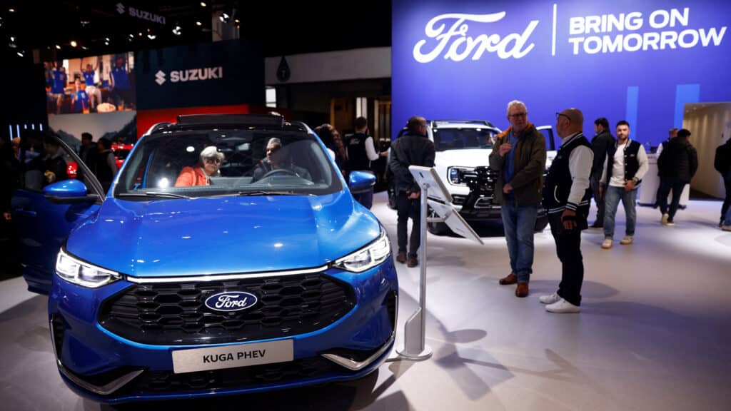 People look at a Ford electric car at the Motor show in Brussels, Belgium January 16, 2025. REUTERS/Johanna Geron