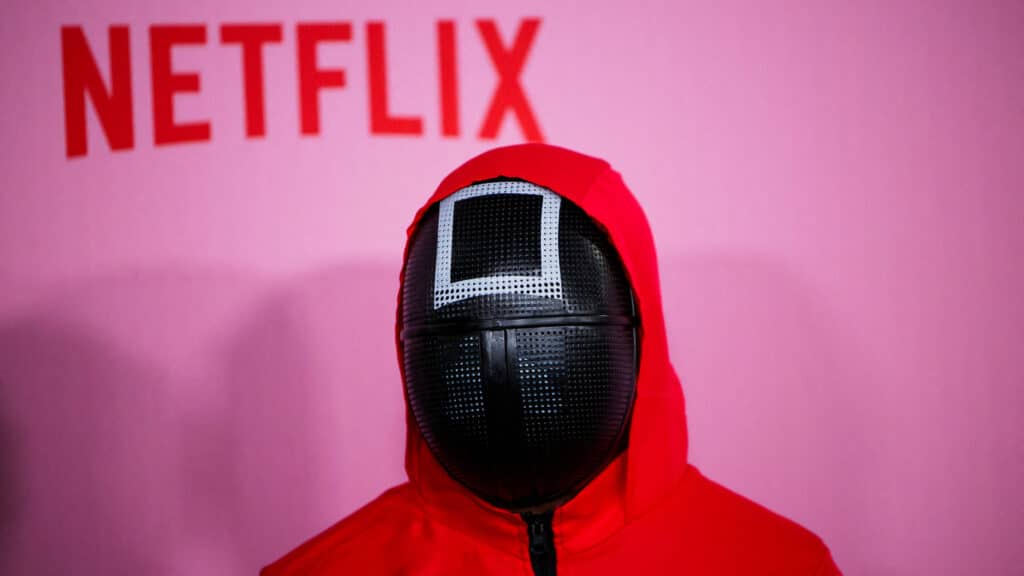 FILE PHOTO: A person dressed as a guard from the Netflix series Squid Game attends a premiere for Squid Game: Season 2, in Los Angeles, California, U.S., December 12, 2024. REUTERS/Daniel Cole/File Photo
