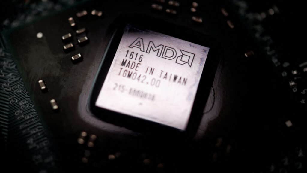 FILE PHOTO: The logo of semiconductor company Advanced Micro Devices Inc (AMD) is seen on a graphics processing unit (GPU) chip in this illustration picture taken February 17, 2023. REUTERS/Florence Lo/Illustration/File Photo