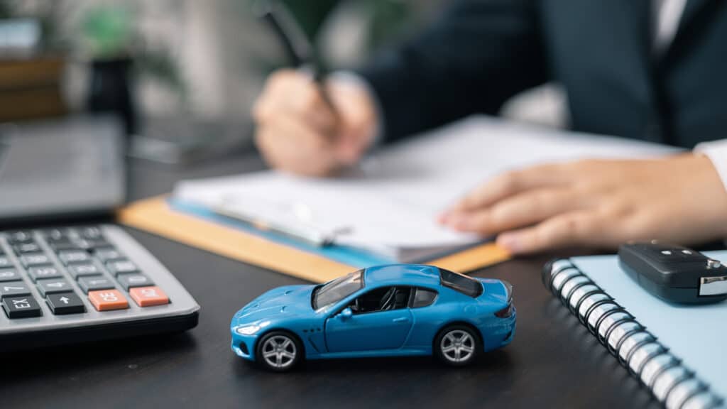 Dealership offered various finance options, including an auto loan or lease, making it easier to buy or rent a car from the company. Agent reviewed contract, finalizing insurance agreement.