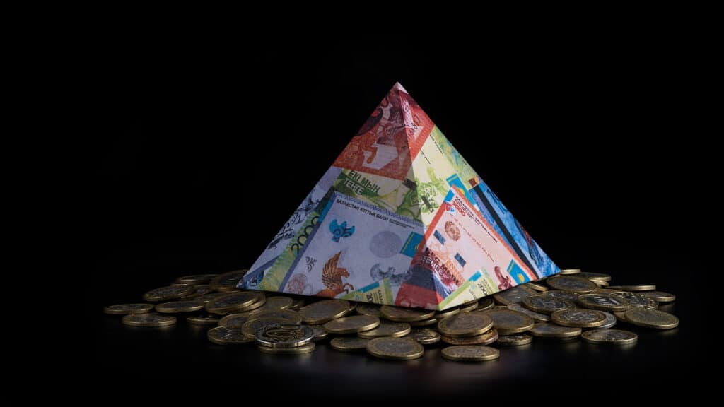 Pyramid with the image of Kazakhstani banknotes - tenge and Kazakhstani coins