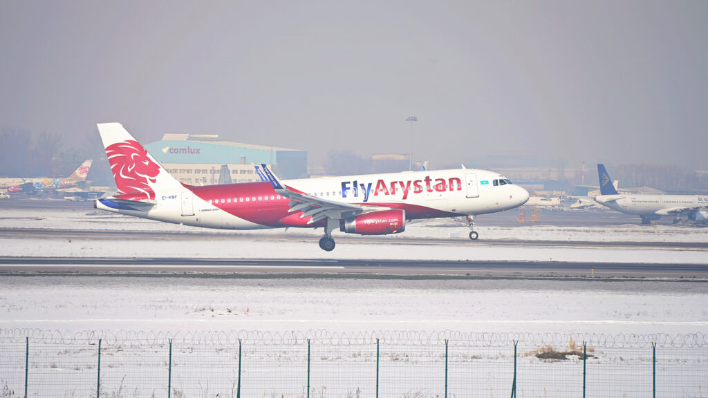 Almaty, Kazakhstan - 02.10.2024 : The Fly Arystan plane lands at the airport on the runway.