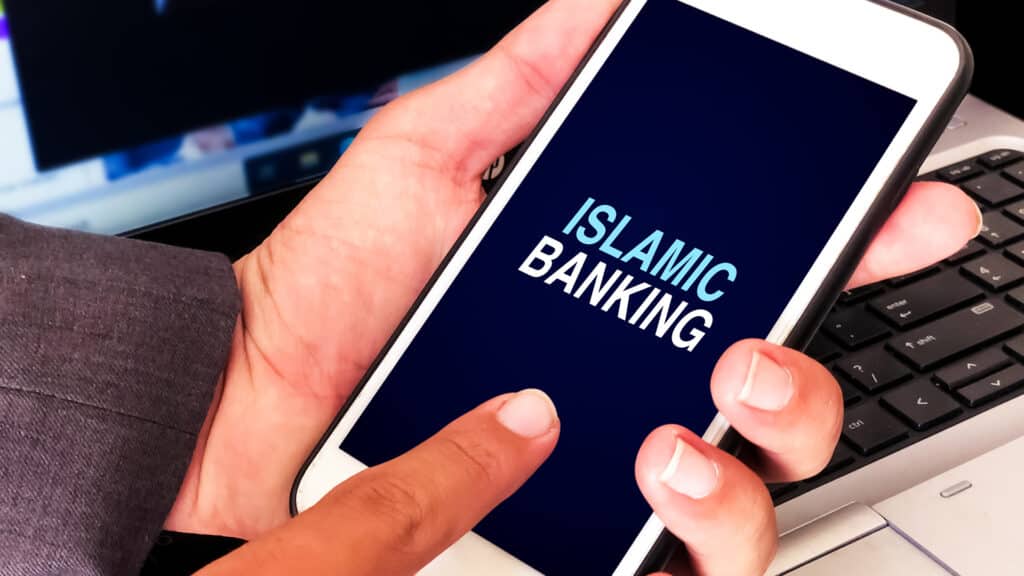 Islamic Banking Digital Concept with Man Touching on Mobile Screen. Finance and business backdrop